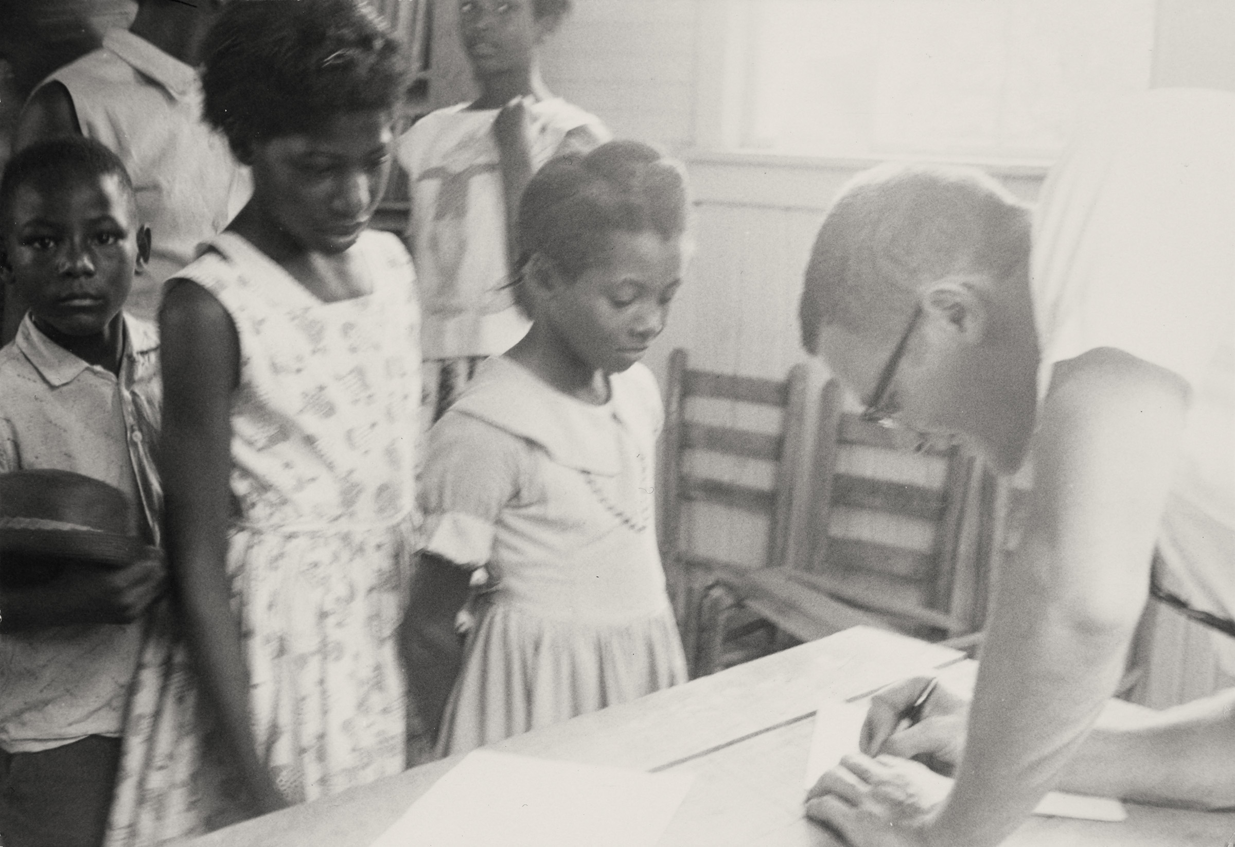 Children Registering for Freedom School, 1964. Photograph by Carol Gross Colca. Children registered for Freedom Schools to learn how to be engaged citizens within their communities and make a difference. Mississippi Freedom Summer Collection, Walter Havighurst Special Collections and University Archives, Miami University Libraries, Oxford OH.