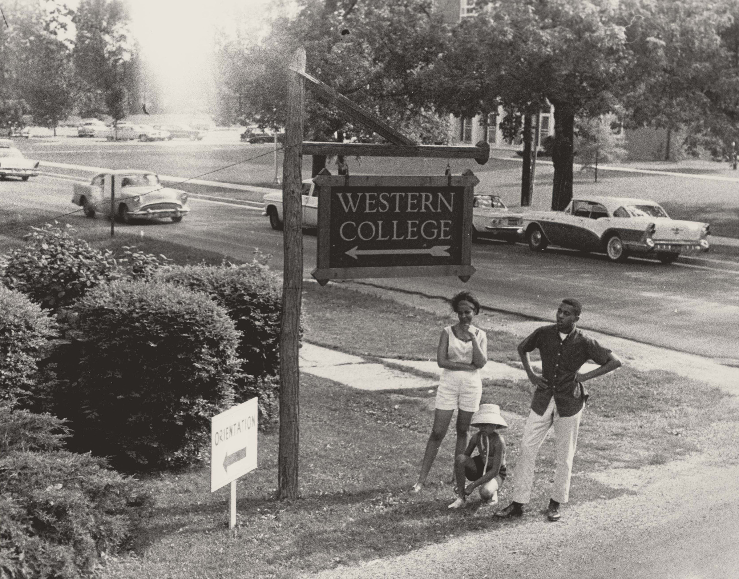 Western College Sign with Three Young People, June 1964. Photograph by Herbert Randall. M351 Herbert Randall Freedom Summer Photographs, Historical Manuscripts, The University of Southern Mississippi.