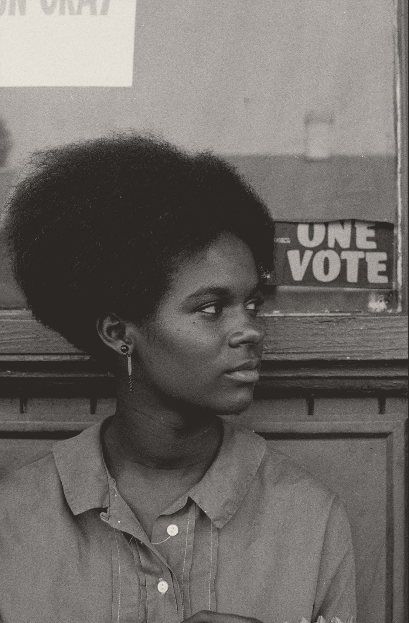 Gracie Hawthorne One Vote, 1964. Photograph by Herbert Randall. Local teenage activist Gracie Hawthorne sits on the steps of the project headquarters in Hattiesburg, Mississippi. Behind her is a SNCC bumper sticker with the Freedom Summer motto, 