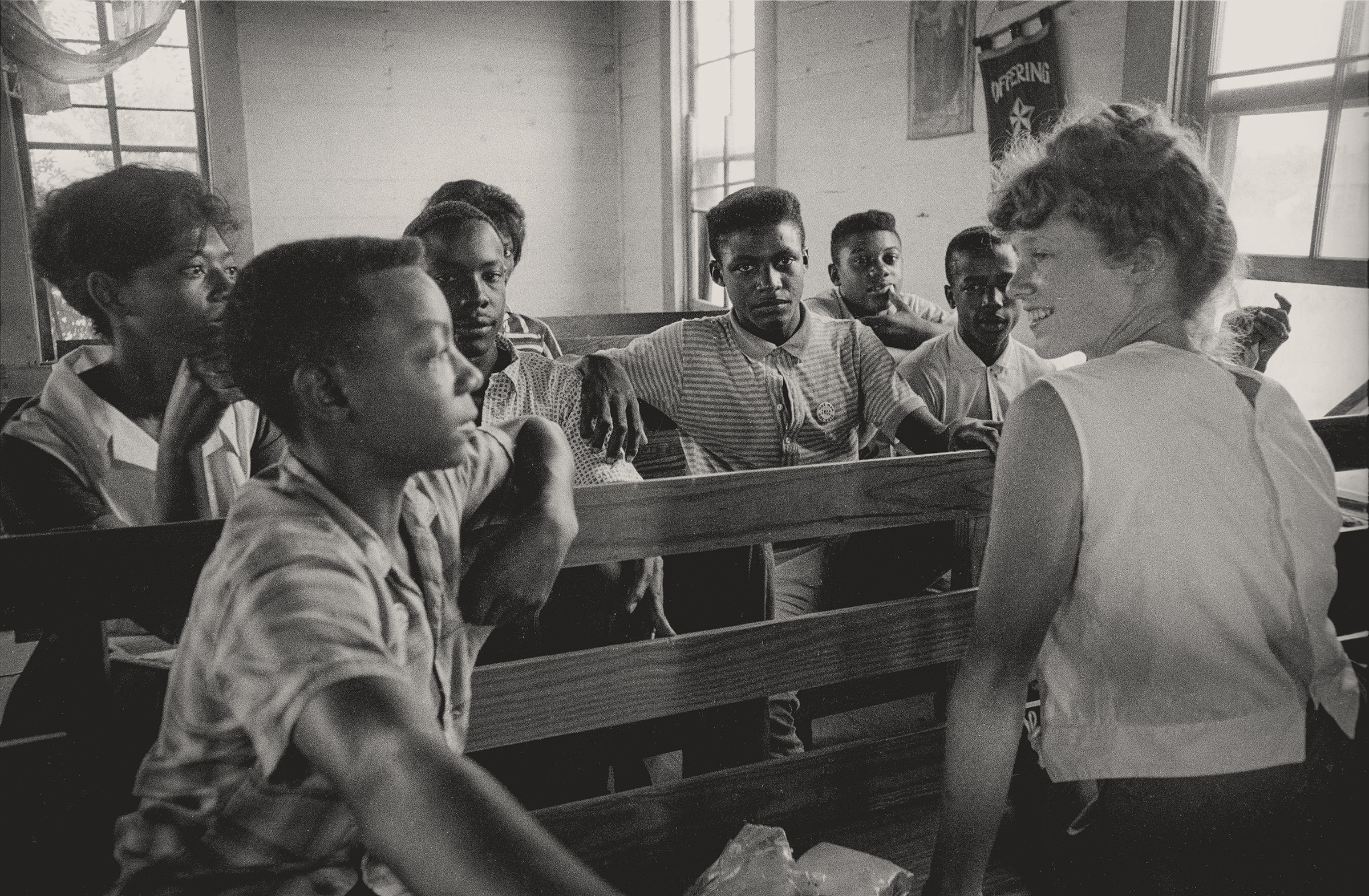 Freedom School, Mileston, Mississippi, August 1964. Photograph by Matt Herron. Edie Black, a volunteer from Smith College, teaches at a Freedom School in Mileston, a community of independent Black farmers in the Mississippi Delta. © 1976, Matt Herron / Photograph provided by TakeStock.