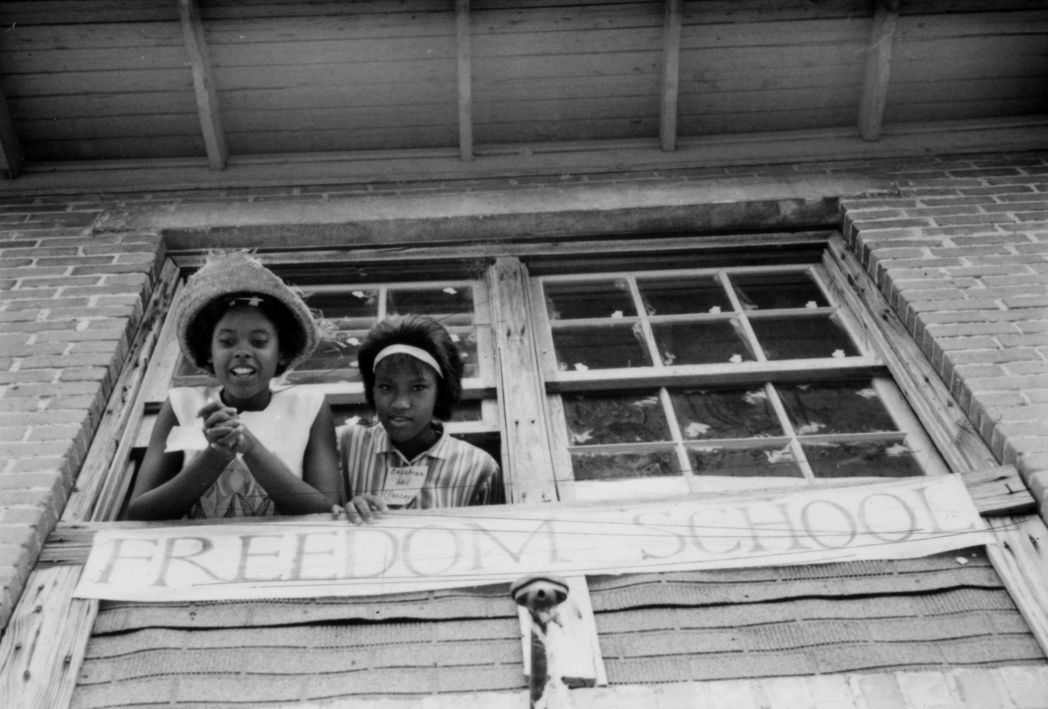 Freedom School, 1964. Photograph by Ken Thompson. Two girls looking out the window of a Freedom School. © The General Board of Global Ministries of the United Methodist Church, Inc. Used with permission of Global Ministries.